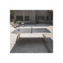 Table Origin Outdoor blanc sur une terrasse en bois