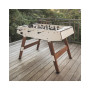 Baby-foot Origin blanc sur une terrasse