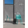 Chaises Bit salice et corallo contre le mur